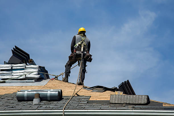 Professional Roof Replacement technician working in Corolla, NC